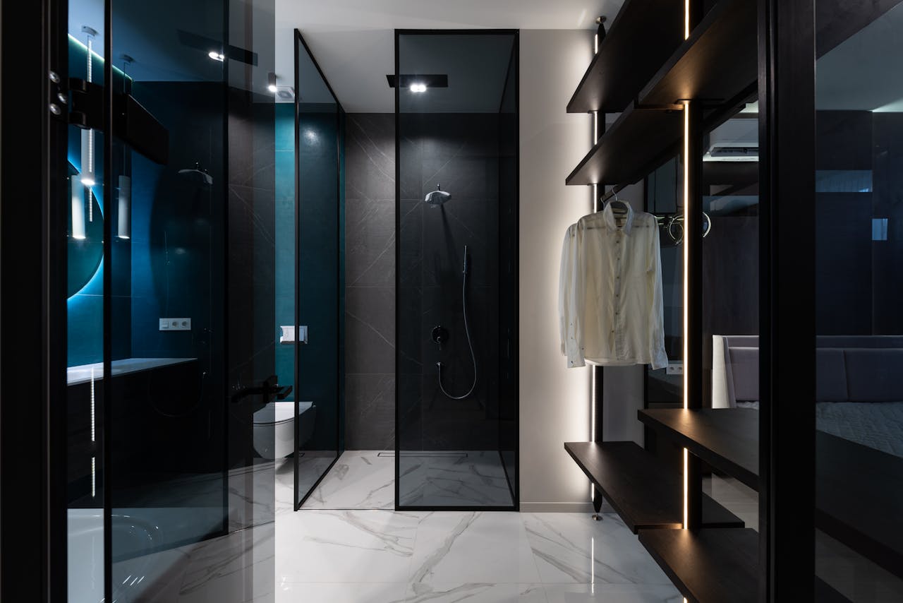 experience-img Discover sleek modern design featuring a bathroom with walk-in shower and closet.